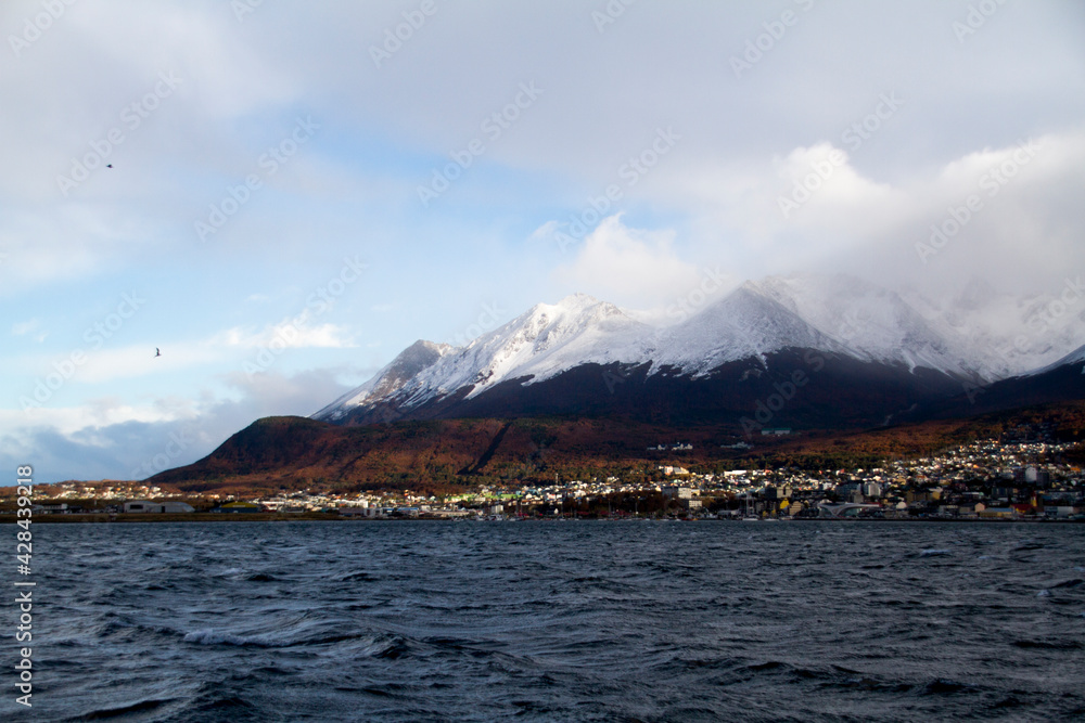 Ushuaia city between the sea and the snow mountains