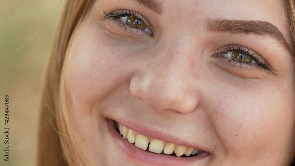 Close up of young smiling girl face. Close up of young smiling girl face.