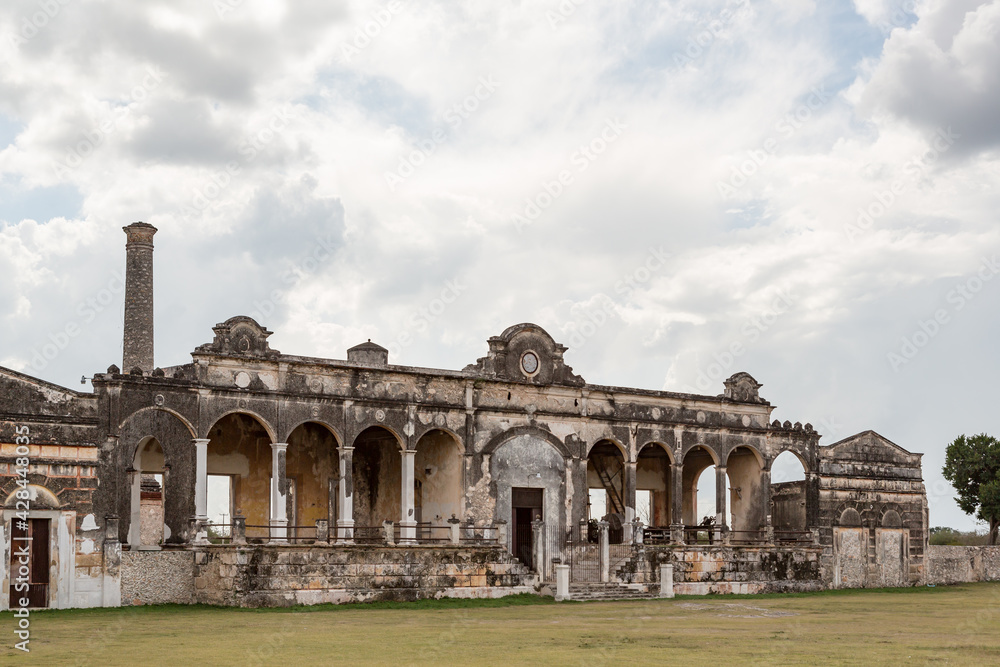 Ruin of an abandoned sisal or henequen agave plantation factory building at Hacienda Yaxcopoil, Yucatan, Mexico
