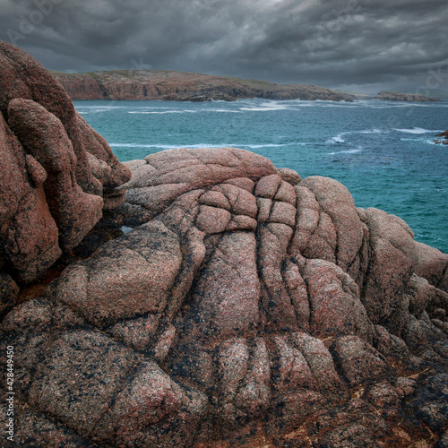 Cruit island - world of red granite rock photo