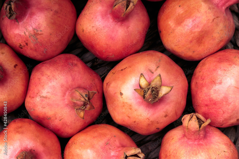 Pomegranate fruit on the market counter, background, close-up. Pomegranate fruit on the market counter, background, close-up.