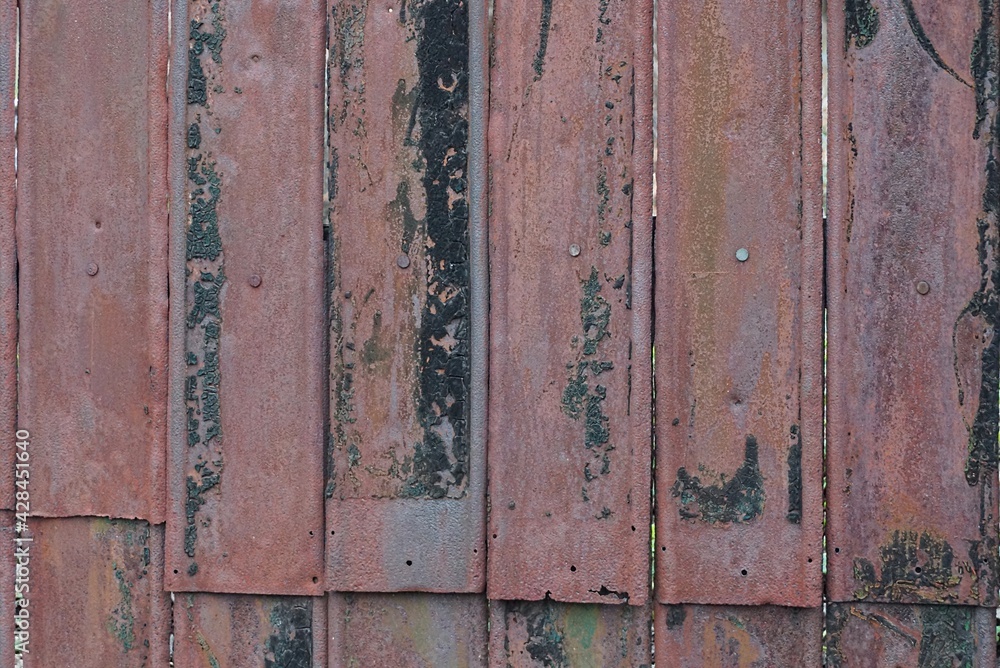 metal texture of rusty black brown iron wall with a seam