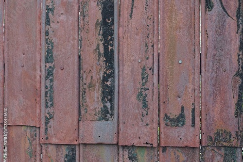 metal texture of rusty black brown iron wall with a seam