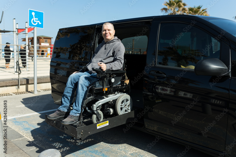 Disabled man on wheelchair lift Disabled man on wheelchair lift