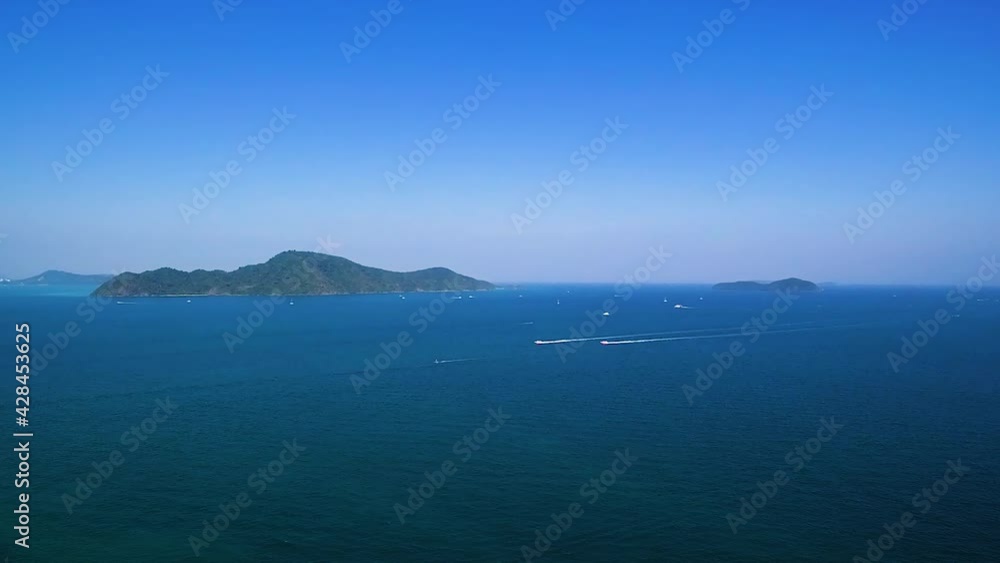 A speedboat runs in the middle of the sea.view from the sea A speedboat runs in the middle of the sea.view from the sea