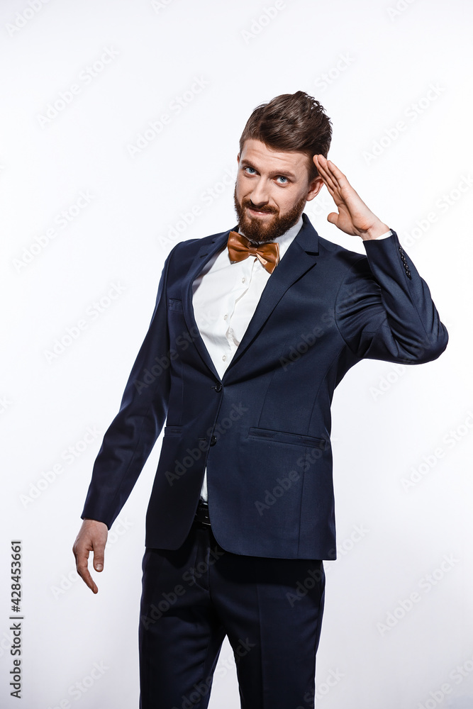 Elegant young handsome man in black classic costume. Studio fashion portrait. Elegant young handsome man in black classic costume. Studio fashion portrait.