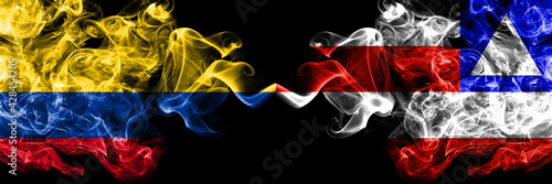 Colombia, Colombian vs Bahia, Brazil smoky mystic flags placed side by side. Thick colored silky abstract smokes flags.