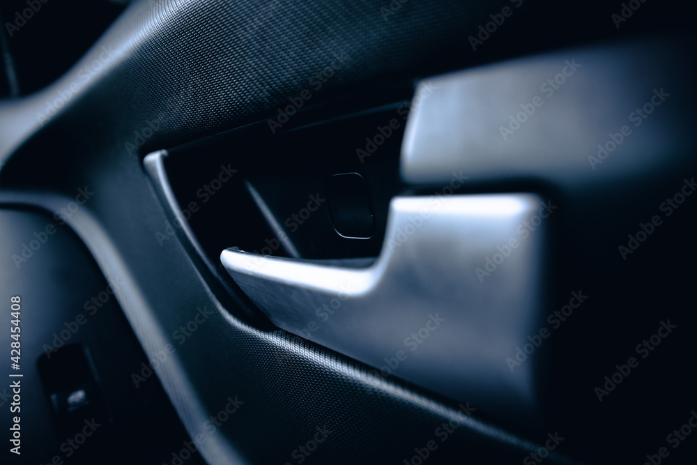 Obraz premium Inner car door handle. The inner side of the door in the car