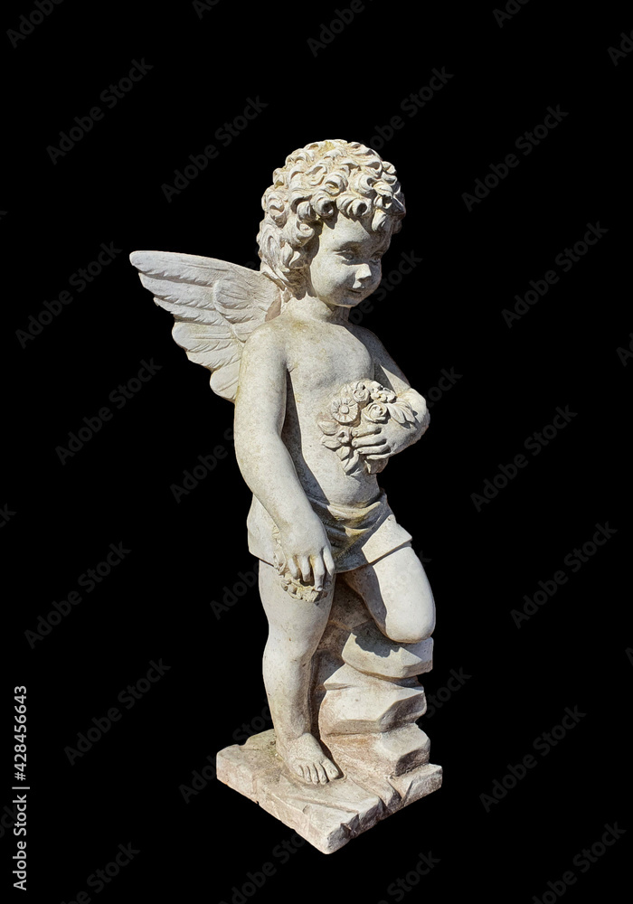 Fototapeta a statue with an angel on a black background