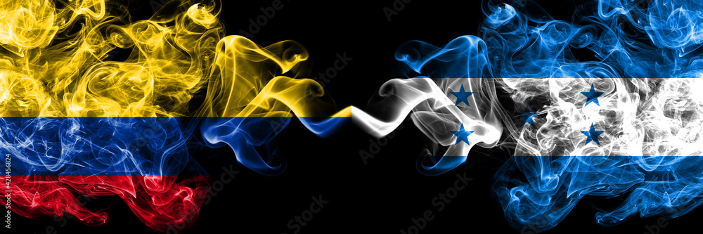 Colombia, Colombian vs Honduras, Honduran smoky mystic flags placed side by side. Thick colored silky abstract smokes flags.
