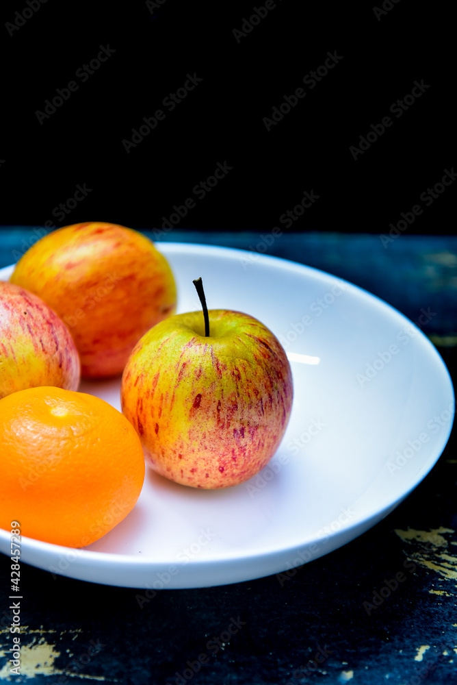 bank dish with tangerine and apples bank dish with tangerine and apples