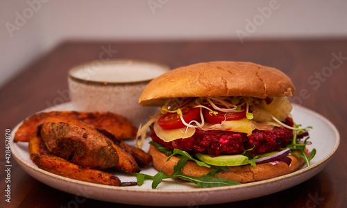 Veggie Burger Beet Root with Fries on white plate