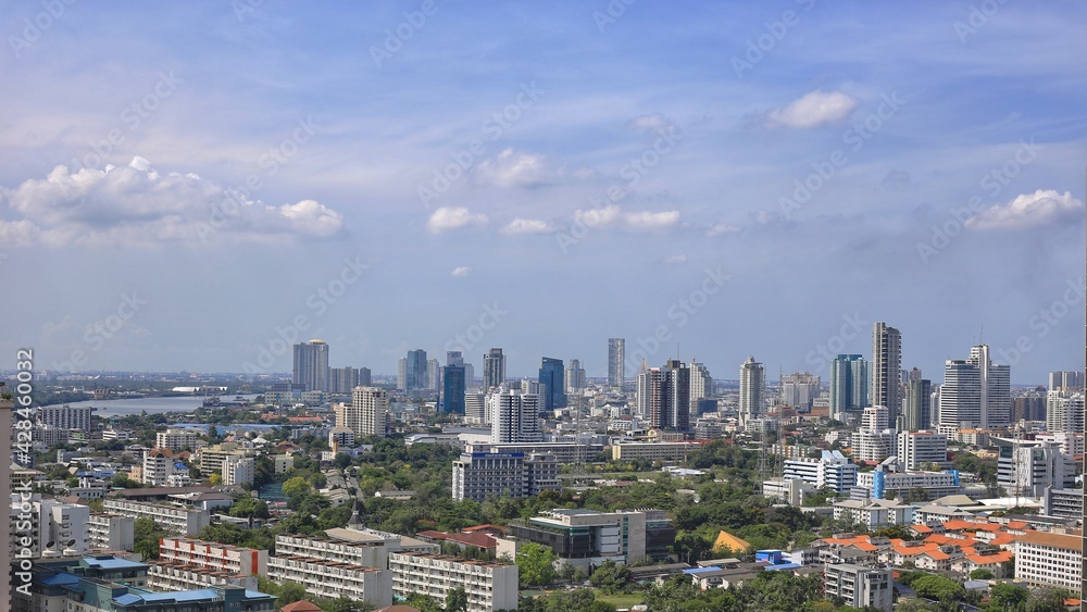 beautiful landscape photo of Bangkok skyline at dawn with Lumpini Park view in foreground