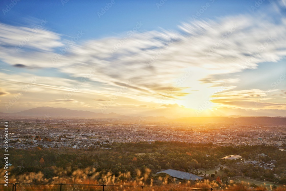 slowshutter photo shot of beautiful panoramic view of moving cloud with sunset on the top of mount wakakusa in Nara prefecture, Japan