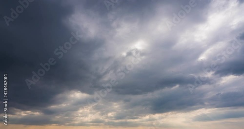 dramatic sky with stormy gray clouds, Hurricane rainy weather nature background. Dark gray sky at sea. B roll footage of Cloudscape screen. Cloudy evening at sea coast. Windy weather summer.4K sunset photo