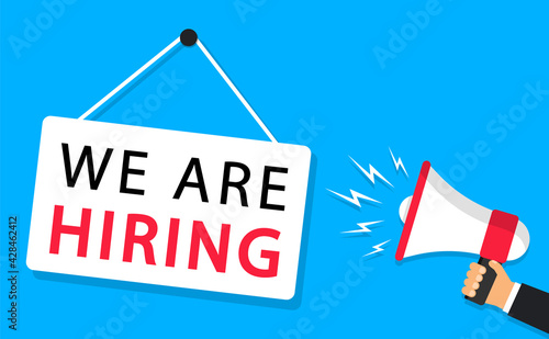 Business recruitment concept. Hand hold a megaphone, signboard we are hiring. Open vacancy poster design. Hiring and recruiting concept. Banner for advertising and marketing. Vector illustration.