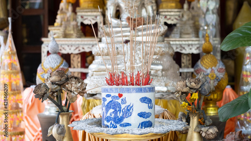 Incense that is lit to worship the Buddha in a censer