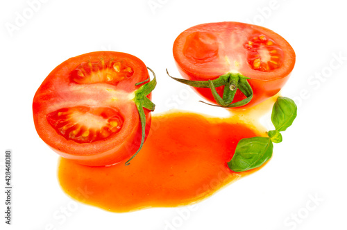 Blot of tomato juice and fresh red tomatoes isolated on white background.