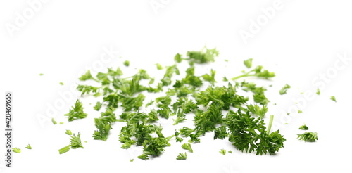 Fresh green chopped french parsley leaves isolated on white background 