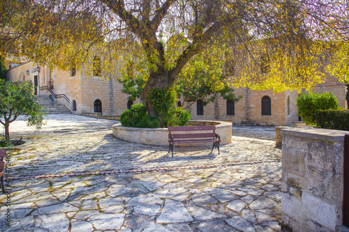 The inner courtyard of the monastery and a bench for the rest of the monks. Monastery of St. Neophytos, Paphos, Cyprus photo