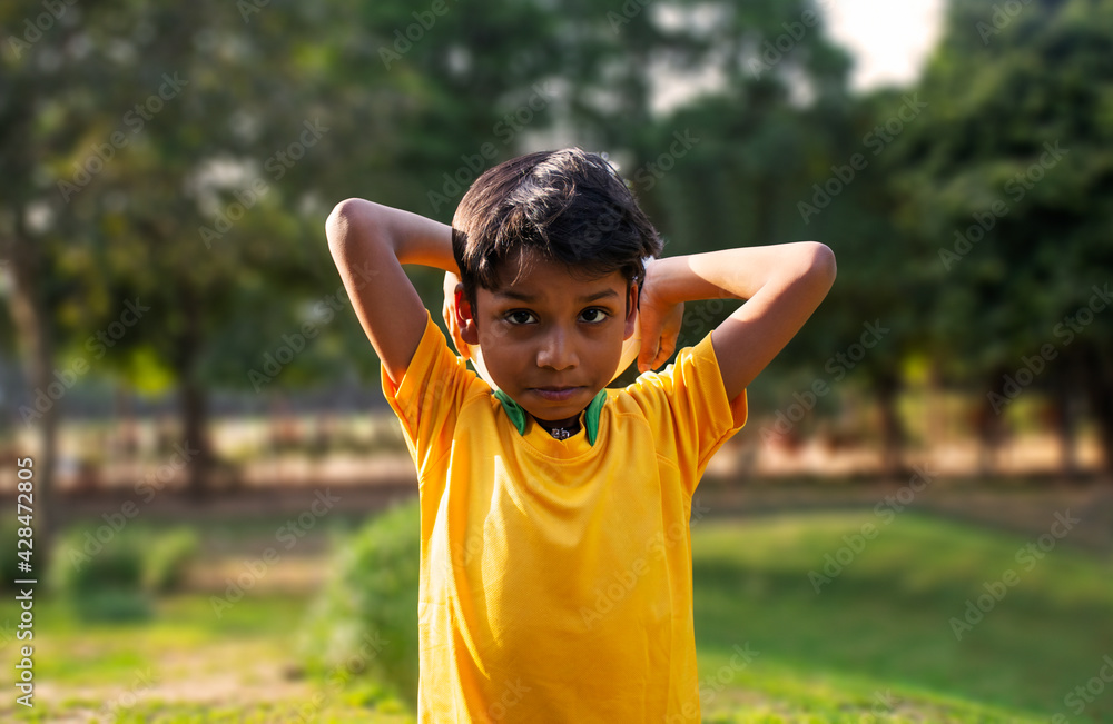 Portrait Of A Young Boy throwing football Portrait Of A Young Boy throwing football