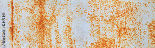 Empty rusty corrosion and oxidized background, horizontal banner. Grunge rusted metal texture. Worn metallic iron wall