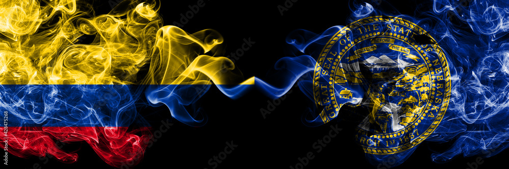 Colombia, Colombian vs United States of America, America, US, USA, American, Nebraska smoky mystic flags placed side by side. Thick colored silky abstract smokes flags. Colombia, Colombian vs United States of America, America, US, USA, American, Nebraska smoky mystic flags placed side by side. Thick colored silky abstract smokes flags.
