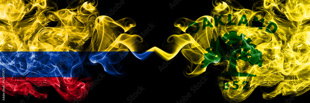 Obraz premium Colombia, Colombian vs United States of America, America, US, USA, American, Oakland, California smoky mystic flags placed side by side. Thick colored silky abstract smokes flags.