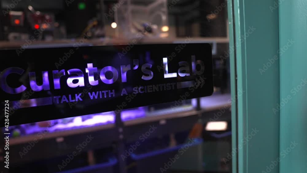 This panning video shows a scientific biology study lab sign that reads This panning video shows a scientific biology study lab sign that reads