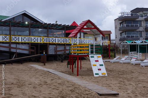 Wallpaper Mural Wooden playgound on the beach without kids on a cloudy day. Torontodigital.ca