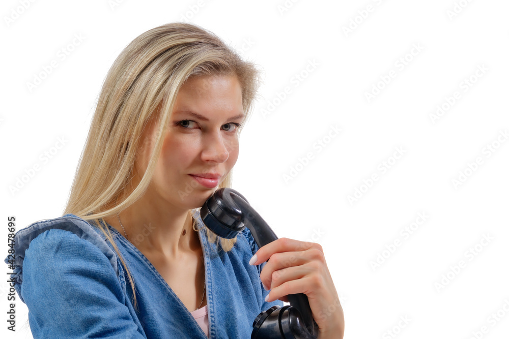 Young beautiful woman holds the receiver of a vintage landline telephone. Isolation on a white background Young beautiful woman holds the receiver of a vintage landline telephone. Isolation on a white background