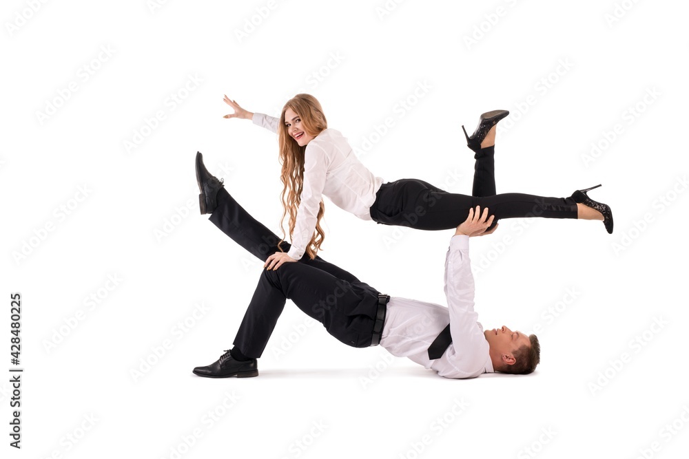 Businessman and businesswoman doing acrobatic trick together