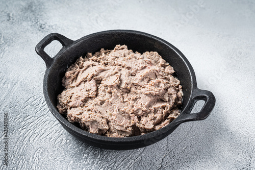 Duck pate Rillettes de Canard in a pan. White background. Top View.  Copy space