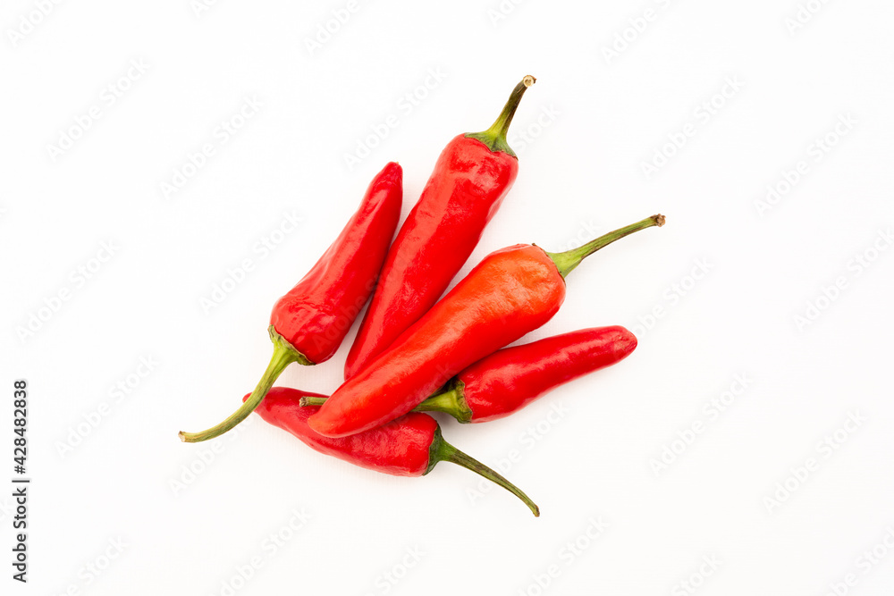five spicy red chili peppers on white background five spicy red chili peppers on white background