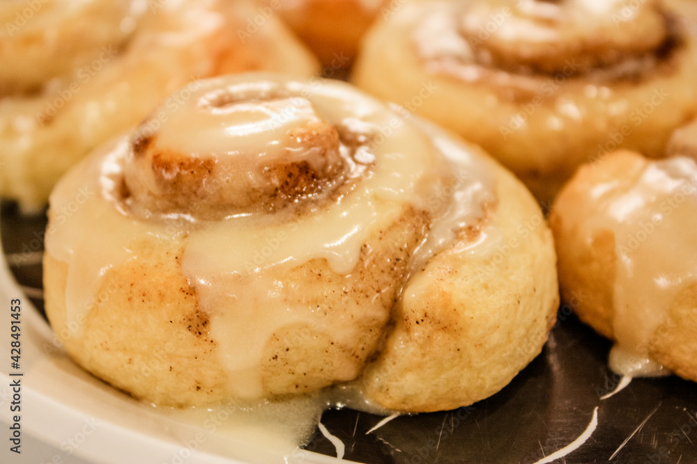 Delicious hot cinnamon roll with icing Delicious hot cinnamon roll with icing