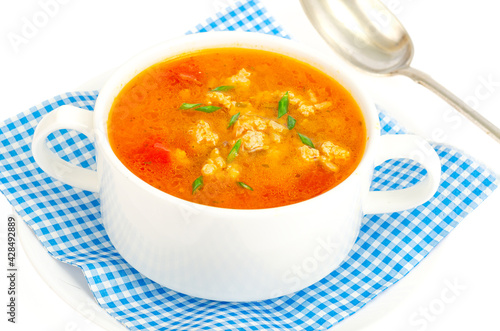 Thick homemade vegetable soup with rice, pumpkin and tomatoes