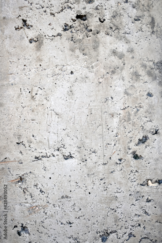 Vertical shot of a rough concrete wall as a background Vertical shot of a rough concrete wall as a background