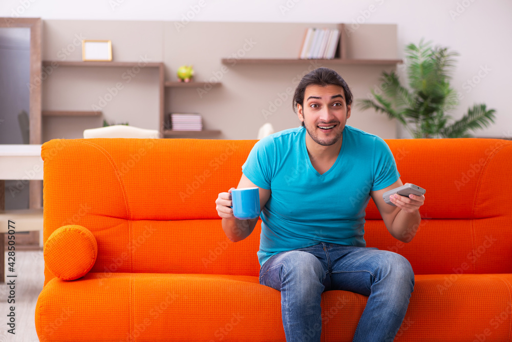 Young male student sitting indoors during pandemic Young male student sitting indoors during pandemic