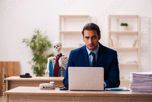 Dead employee working in the office