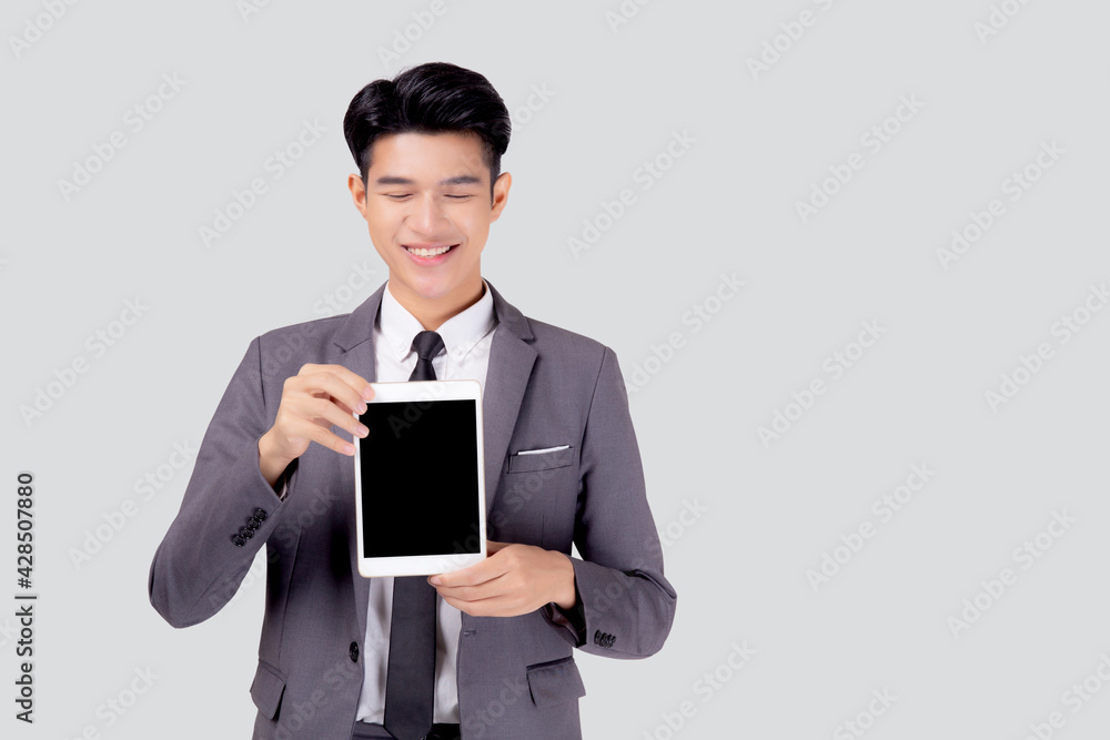Portrait young asian business man showing and presenting tablet computer with blank with success isolated on white background, businessman standing and holding touchpad digital, communication concept. Portrait young asian business man showing and presenting tablet computer with blank with success isolated on white background, businessman standing and holding touchpad digital, communication concept.