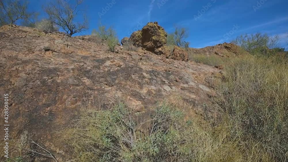 Slow Pan Down On Large Red Boulder Rock With Green Lichen To Dry Bush In Fountain Hills Arizona Desert Botanical Gardens Hiking Trail
Slow Pan Down On Large Red Boulder Rock With Green Lichen To Dry Bush In Fountain Hills Arizona Desert Botanical Gardens Hiking Trail