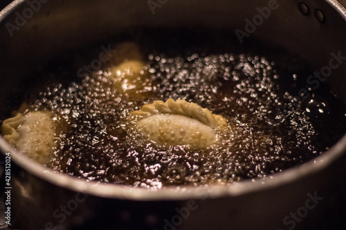 close up of a frying pan empanada