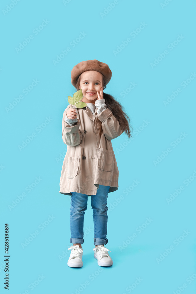 Stylish little girl in autumn clothes on color background Stylish little girl in autumn clothes on color background