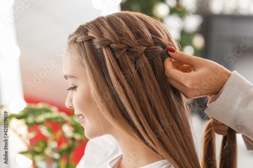 Hairdresser working with client in beauty salon photo
