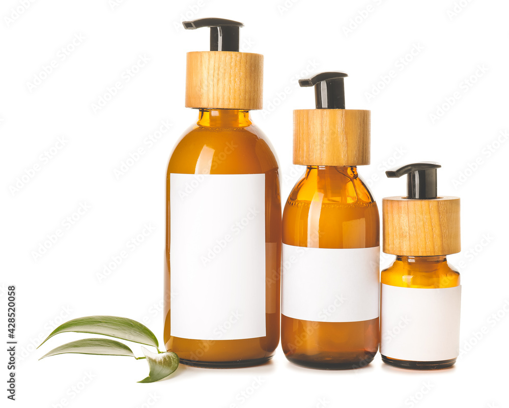 Bottles with natural shampoo on white background Bottles with natural shampoo on white background