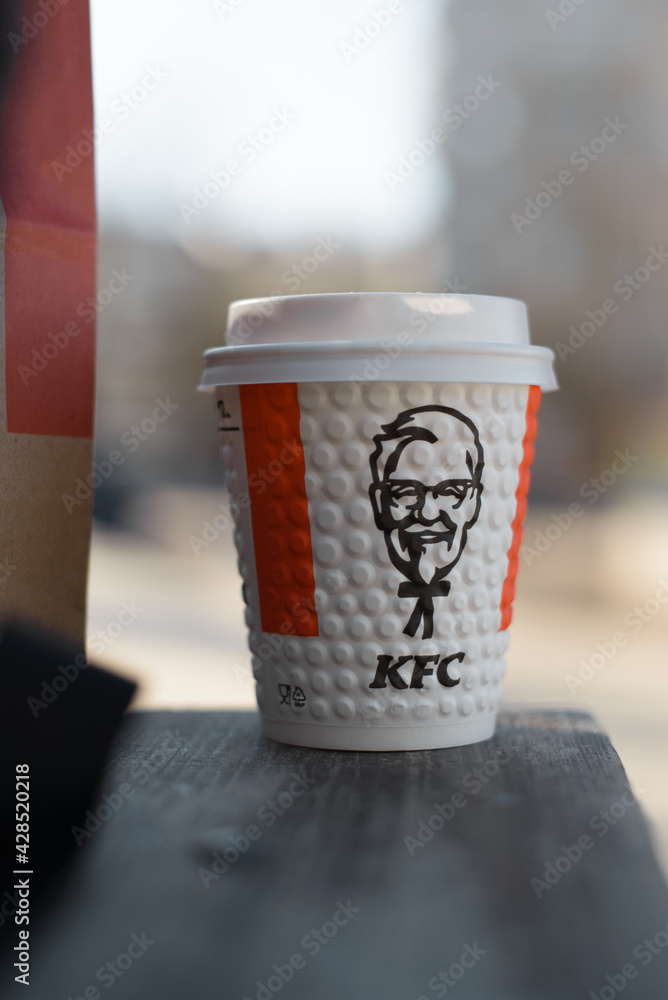 Paper cup from KFC restaurant with image of Colonel Sanders standing on ...