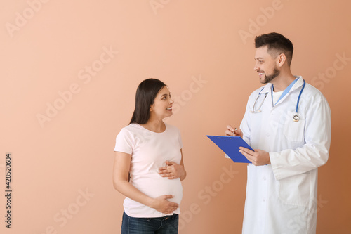 Young pregnant woman with d...