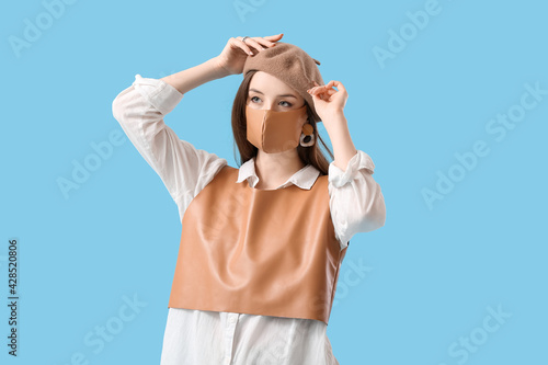 Fashionable young woman wea...