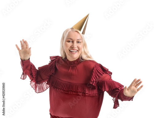 Mature woman in party hat o...
