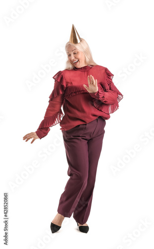 Mature woman in party hat o...